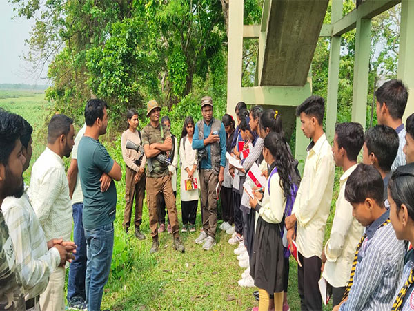 Field Director of Orang National Park and Tiger Reserve interacting with a group of school children (Photo/ANI)