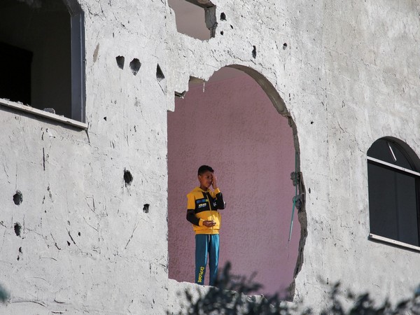 A child stands inside a building, damaged in an Israeli strike in Rafah (Photo/Reuters)