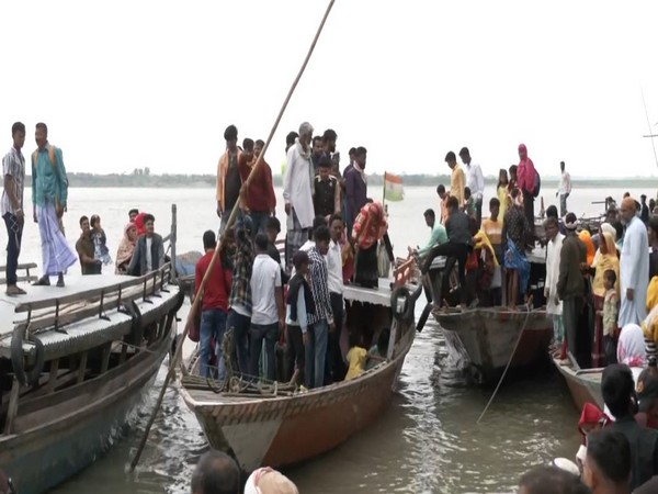 voters of Dhubri Ghat in Assam, used boats to arrive at a polling booth to cast their votes (Photo/ANI)
