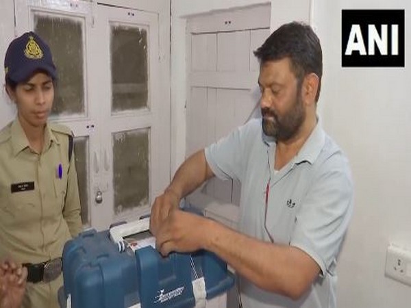 Polling officials seal Electronic Voting Machines (EVM) and VVPATs. (Photo/ANI)