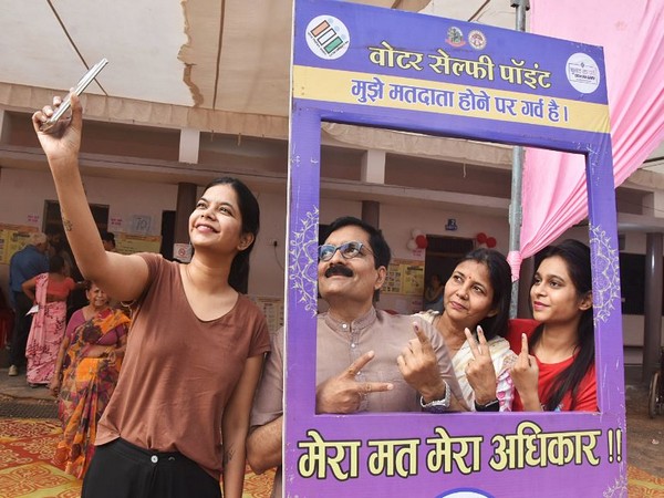 Voters take a selfie at a selfie point after casting their vote in Gwalior. (Photo/ANI)