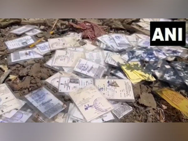 Voter ID cards dumped at garbage dumping site in Maharatra’s Jalan district. (Photo/ANI)