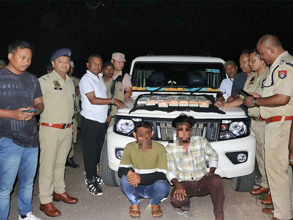 Assam police with the seized drugs. (Photo/ANI)