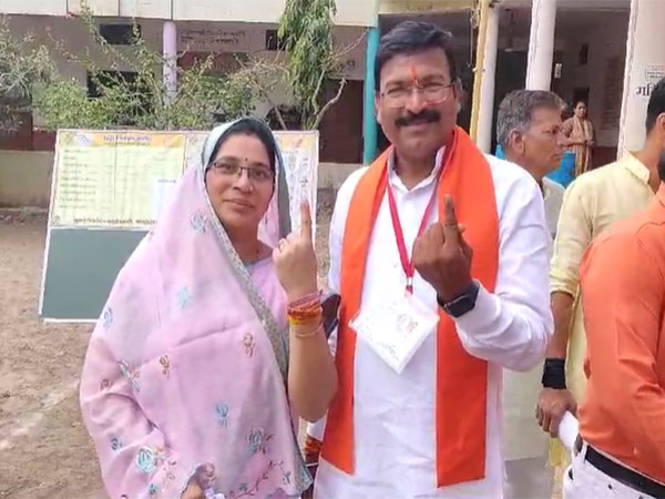 BJP nominee from Khargone Lok Sabha Gajendra Patel with his wife (Photo/ANI)