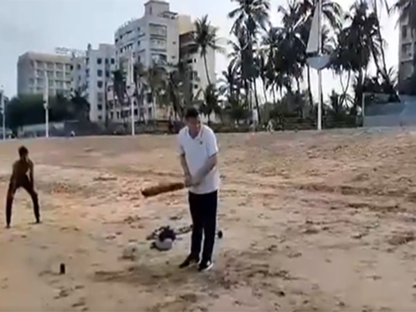 Uttarakhand CM Dhami playing cricket at Juhu Beach (Image/ANI) 