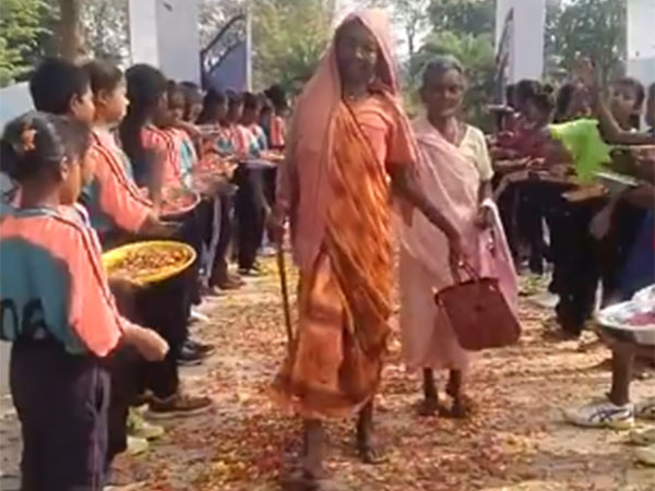 Elderly woman showered with flowers at a polling booth in Simdega (Image/ANI)