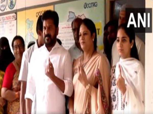 Telangana Chief Minister Revnath Reddy, his family members show their inked fingers after casting their votes. (Photo/ANI)