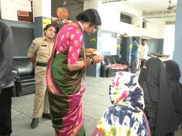 BJP candidate Madhavi Latha checks voter identity cards (Photo/ANI) 