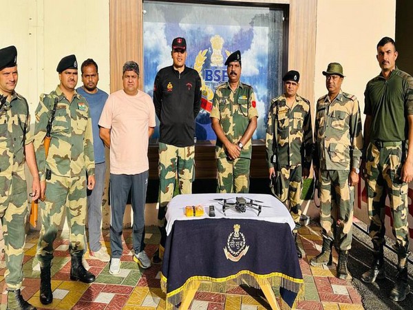 BSF team with recovered drone. (Image/ANI) 