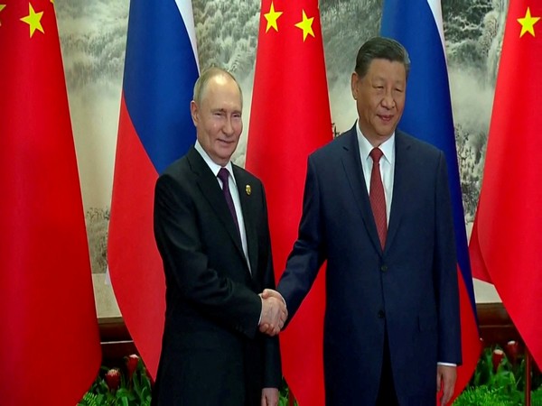 Russian President Vladimir Putin and Chinese President Xi Jinping meet in Beijing (Photo/Reuters)