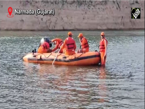 Rescue officials in search operation in Narmada River in Gujarat. (Image/ANI)