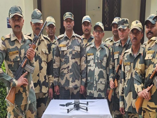 BSF officials with recovered Pakistani drone. (Photo/ANI)
