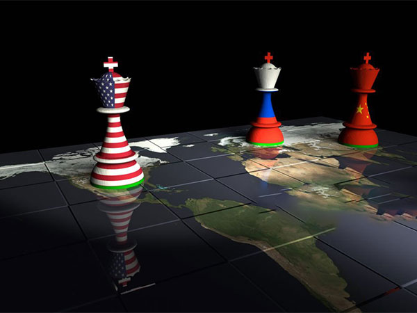 Render of a chessboard decorated a map of the earth and with pieces decorated with the American, Chinese and Russian flags. (Image credit/Pexels)