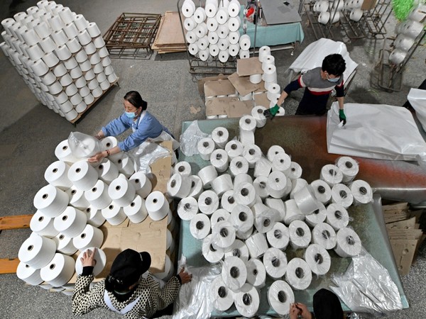 Workers are seen on the production line at a cotton textile factory in Korla, Xinjiang Uighur Autonomous Region, China (Photo/Reuters)