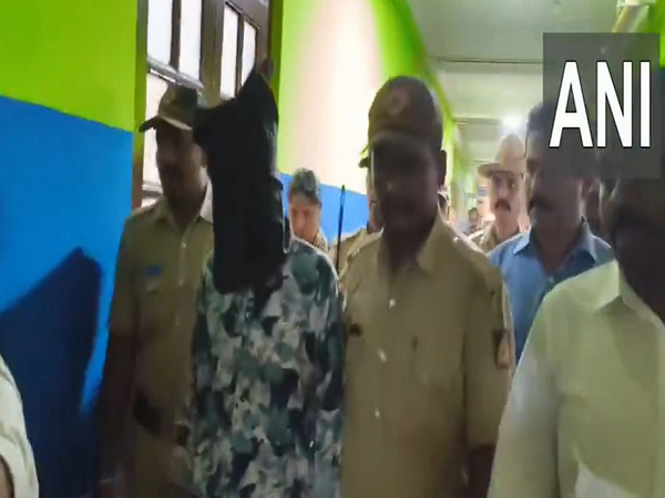 Accused Girish being taken by officials (Photo/ANI)