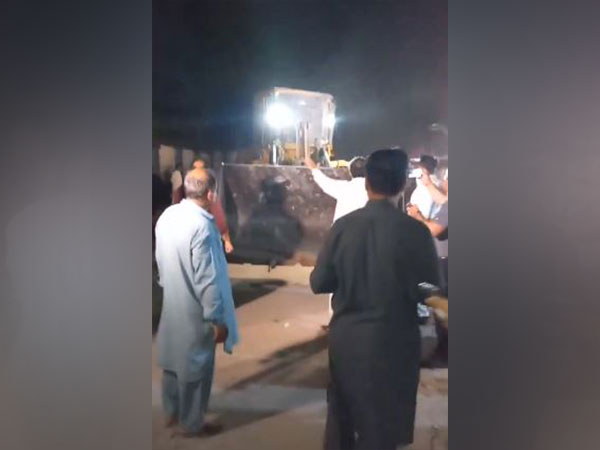 Video shows bulldozer outside PTI's central office (Screengrab of video posted by PTI Islamabad on X)
