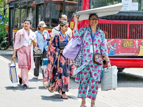 Polling officials leave after collecting EVMs and other election materials in New Delhi. (Photo/ANI)