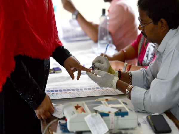 A voter gets her finger marked with indelible ink  in Gautam Buddha Nagar District, Uttar Pradesh. (Photo/ANI)