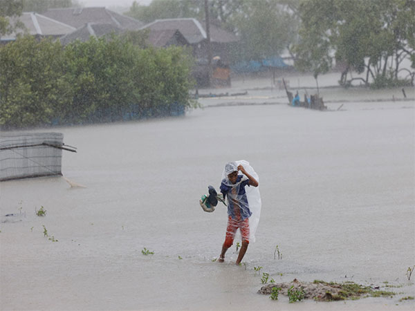 A boy wades through water during heavy rain as Cyclone Remal hits Bangladesh in the Shyamnagar area of Satkhira. (Image credit: Reuters)