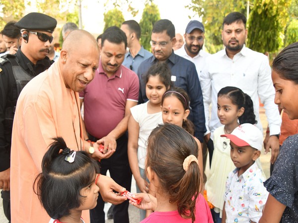 Uttar Pradesh Chief Minister Yogi Adityanath with children at Gorakhnath Temple (Photo/ANI)