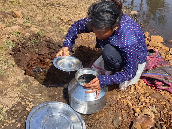 Villagers in Mariampur collect drinking water. (Photo/ANI)