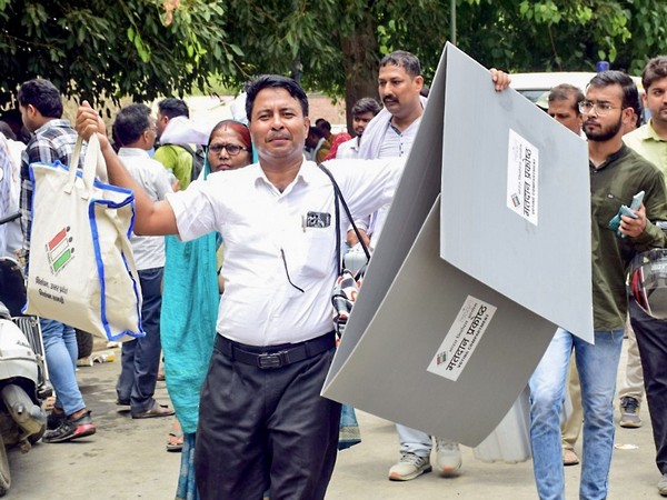 Poll official carrying EVMs as Lok Sabha election enters final phase (Photo/ANI)