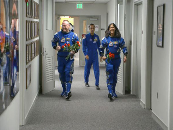 NASA’s Boeing Crew Flight Test astronauts Butch Wilmore and Suni Williams exit the Astronaut Crew Quarters inside Kennedy Space Center. (Photo/NASA Kennedy)