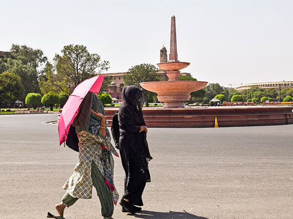 Women walk at the Vijay Chowk while covering themselves with a dupatta (Photo/ANI)