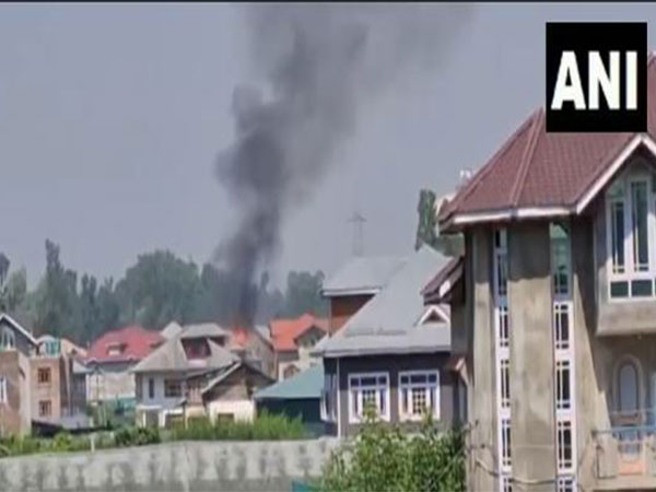 Smoke coming out from a house where terrorists are trapped in Pulwama (Photo/ANI)