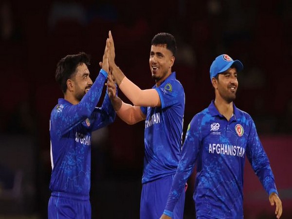Rashid Khan (left) with Afghanistan team (Photo: ICC/ X)