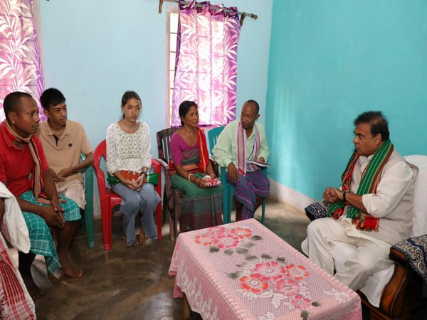Assam CM with the members of Birubala Rabha (Photo/@himantabiswa)