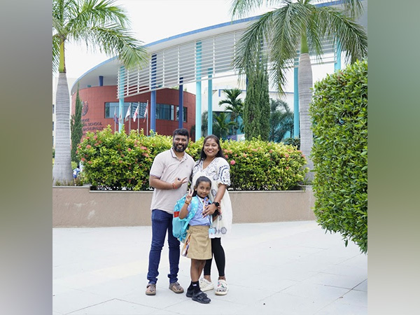 Happy parent dropping off their little scholar on the first day of the new academic year 2024-2025