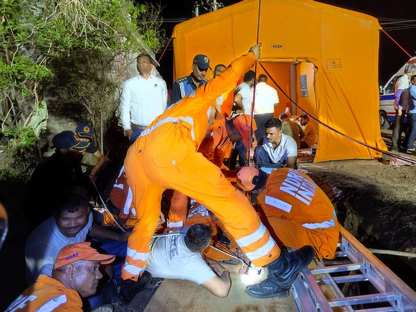 Rescue personnel at Amreli where a toddler fell into a borewell . (Photo/ANI)