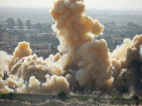 Smoke rises as a house is blown up during a military operation in Rafah (Photo/Reuters)