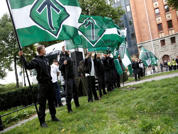 Supporters of the neo-Nazi Nordic Resistance Movement hold their banners during a demonstration at the Kungsholmstorg square in Stockholm (Photo/Reuters)