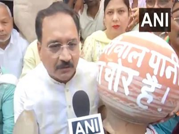 Delhi BJP chief Virendraa Sachdeva along with party workers hold protest over water crisis in national capital (Photo/ANI) 