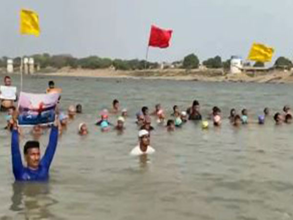 Swimmers from different age groups performed Yoga in the river near Triveni Sangam in UP's Prayagraj (Photo/ANI)