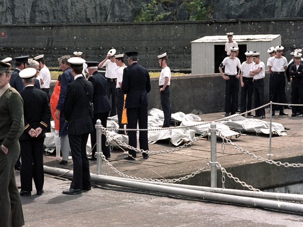 Officers,sailors and rescue workers looked on as bodies of victims of Air India flight which crashed in the Atlantic Ocean were lined up on docks (File Image) (Image Credit: Reuters)