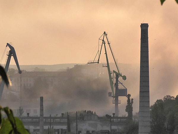 Smoke rises from the shipyard that was reportedly hit by Ukrainian missile attack in Sevastopol (Photo/Reuters)