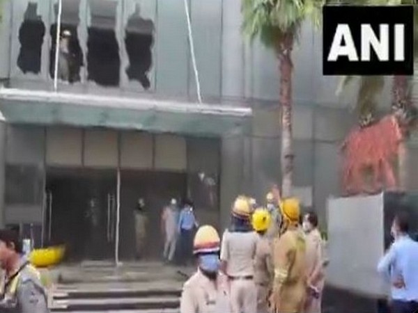 Rescue personl outside the Logix Mall at Noida-Sector- 32 after a fire broke out on July 5. (Photo/ANI)