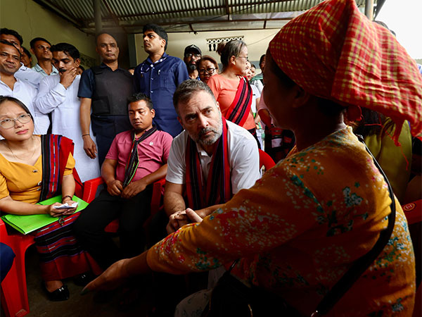 Congress leader Rahul Gandhi interacts with displaced victims of the deluge in Assam (X/@INCIndia)