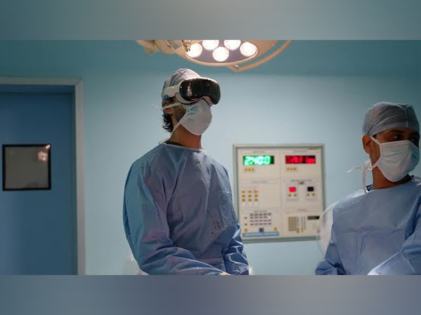 Dr. Manu Bora performing surgery with the assistance of the Apple Vision Pro