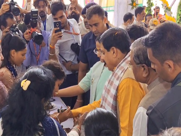Women applying mehndi to CM Mohan Yadav (Photo/ANI)