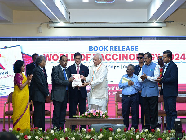 Arif Mohammad Khan, Governor of Kerala releasing the book 'World of Vaccinology 2024', co-authored by Dr M.I. Sahadulla, and Dr Sayenna Uduman.