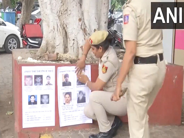Earlier visual of Delhi Police putting posters of Al-Qaeda terrorists (Photo/ANI)