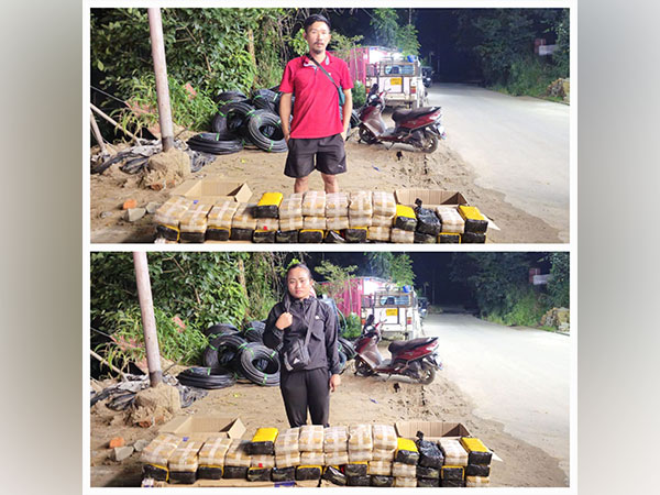 Apprehended accused with seized methamphetamine (Photo/Mizoram Police)  