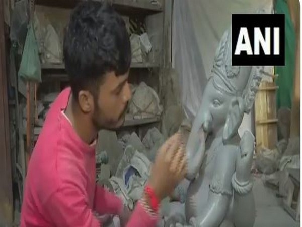 Craftsman makes Ganesh idol in Ahmedabad. (Photo/ANI)