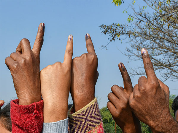 ranchi: Voters show their ink-marked fingers. (Photo/ANI)