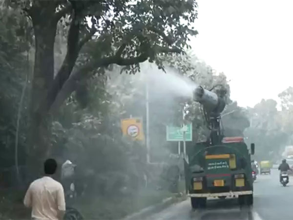 Trucks sprinkle water to bring down pollution in Delhi NCR (Photo/ANI)