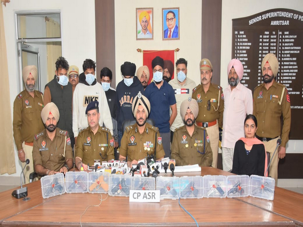 Punjab police personnel with the accused (Pic/Information and Public Relations Department, Punjab)